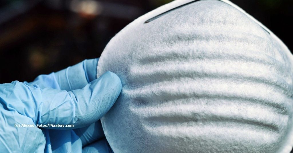 Prostata Hilfe Deutschland: Hand hält Mundschutz